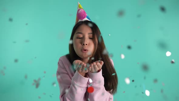 Cheerful Birthday Girl Blowing Colored Sparkles