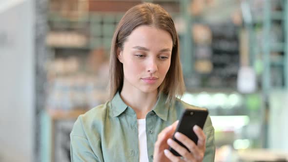 Portrait of Attractive Woman Using Smartphone 