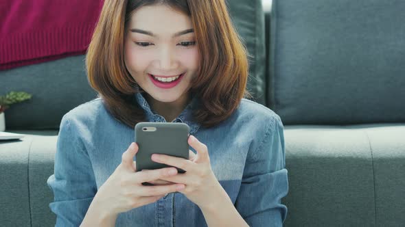 woman enjoy choose and pick product from smartphone shop with happiness and joyful