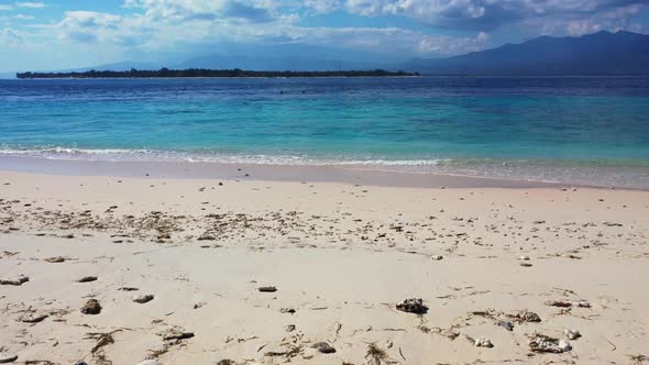 Aerial top down texture of exotic coastline beach journey by aqua blue ocean with white sandy backgr