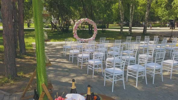 Wedding Venue and Chairs Near Treats in Park Upper View