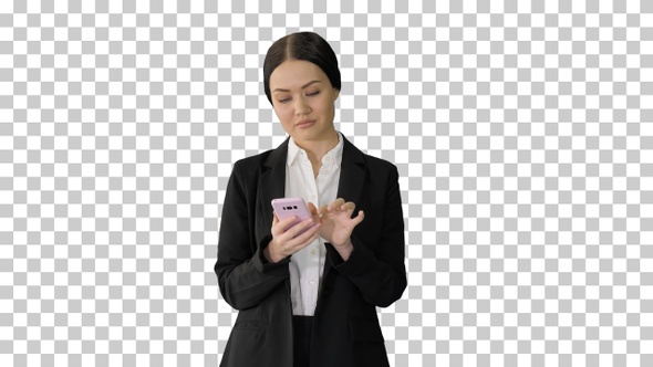 Casual female in a suit texting on her phone, Alpha Channel