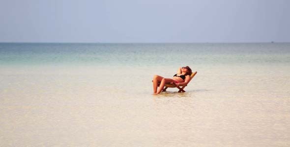 Woman Sunbathing In Gorgeous Water, Cambodia