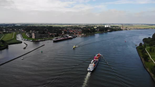 containerbarge shipping containers at a dutch river