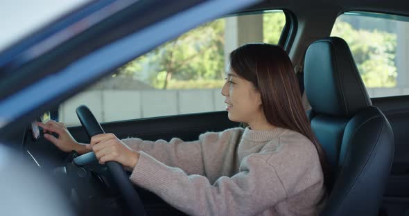 Woman Drive a Car and Use of Mobile Phone for Gps Location