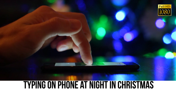 Typing On Phone At Night in Christmas