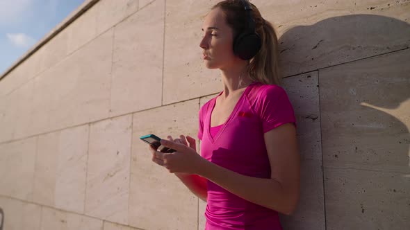 Fit Woman Enjoying Music After Workout