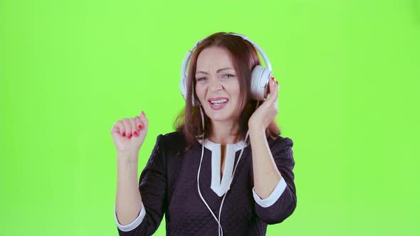 Lady Listening To Music on Headphones, Green Screen
