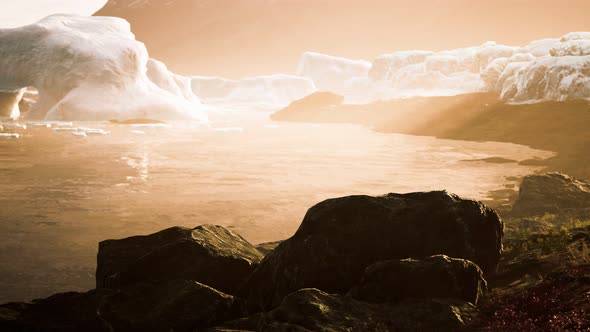 Antarctic Icebergs Near Rocky Beach