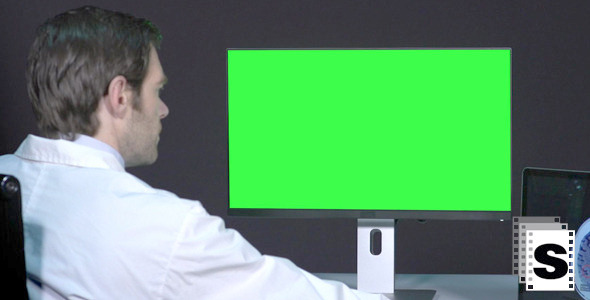  Male Doctor Working With Green Screen