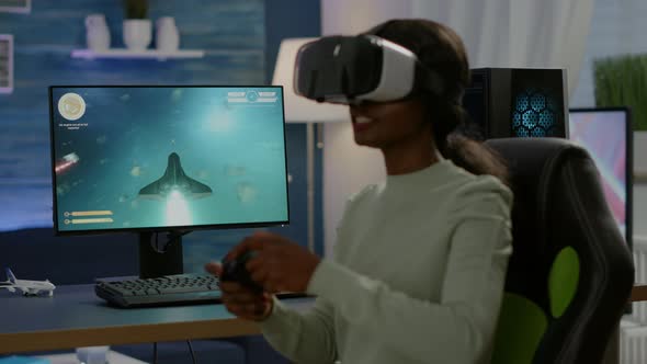 African Gamer Playing Space Shooter Competition Using Virtual Reality Goggles