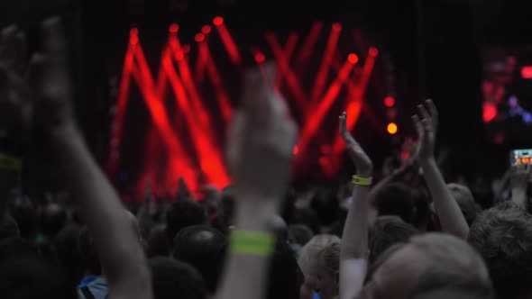 A Slow Motion of a Cheering Crowd at a Concert Show