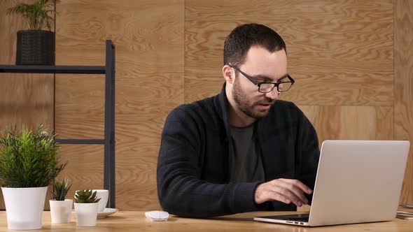 Man with Laptop Talking To Himself