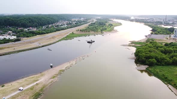 Barge with industrial equiptment at conjuction of Nemunas and Neris river