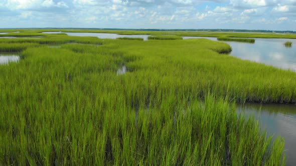 drone shots of the sand dunes and marsh lands at the coast