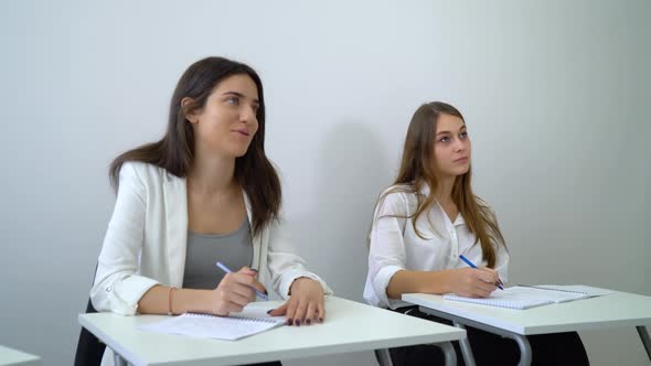 Female Student Responding to Teacher in Class