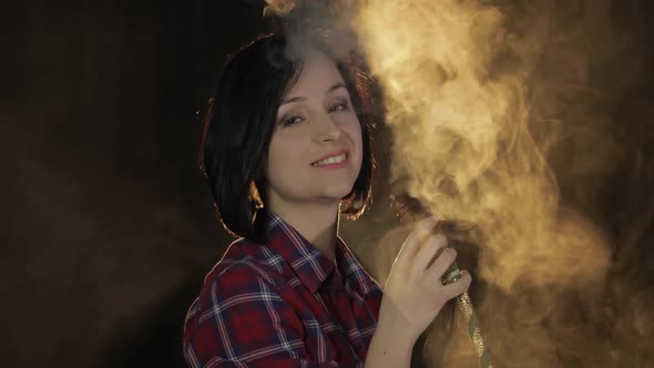 Beautiful, Young Woman Smoking Hookah. Attractive Girl Smoking Flavored Tobacco