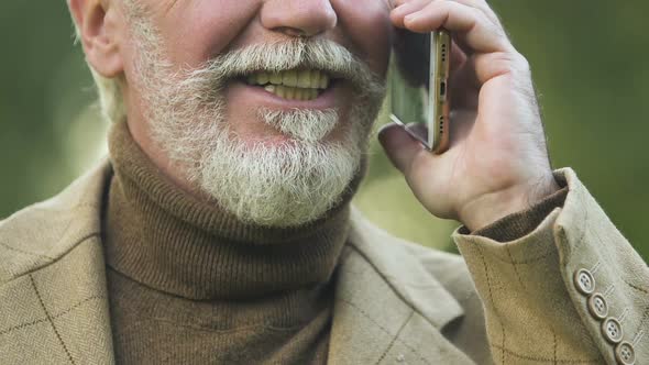 Smiling Mature Man Talking on Smartphone, Favorable Tariff Plans, Connection