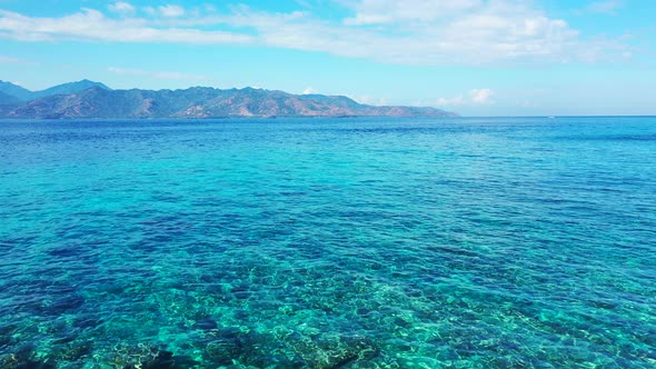 Beautiful crystal clear waters off the coastline of the tropical island of Bora Bora