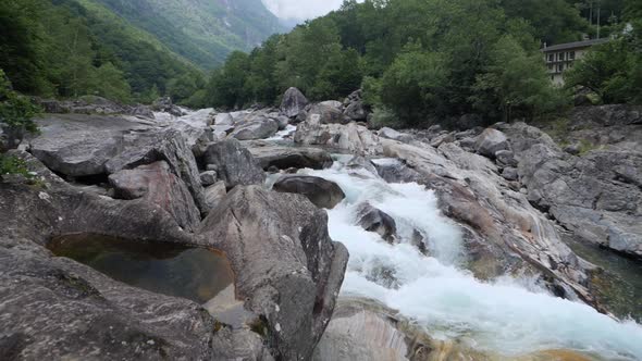 small creek in mountains in Switzerland, Valle Verzasca slow-motion waterfall rumbling water, Big Ho