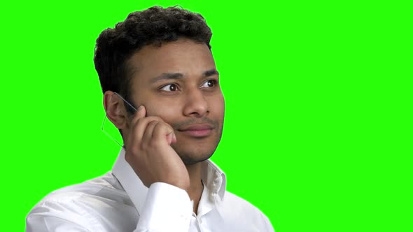 Cheerful Indian Man Talking on Futuristic Transparent Phone