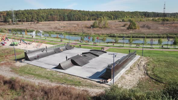 Skate park. Professional skateboarders skateboarding in park