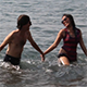Happy Couple Coming Out of the Sea - VideoHive Item for Sale