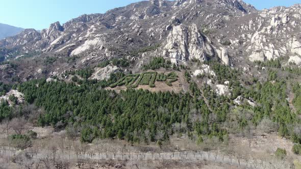 Aerial photo of mountain scenery led by phoenix in spring