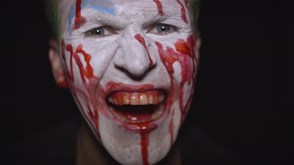 Clown Halloween Man Portrait. Creepy, Evil Clowns Blood Face. White Face Makeup