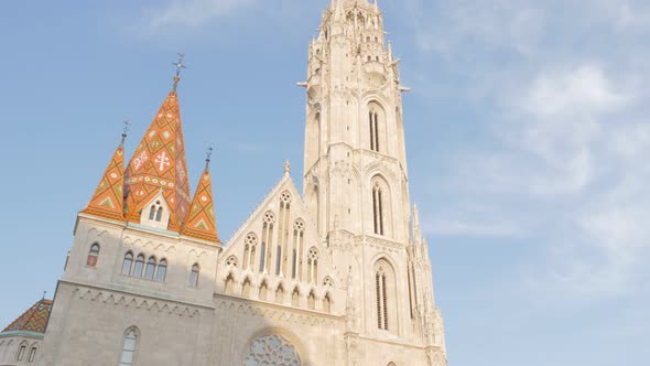 Matthias Church tower on Buda side of Budapest against blue sky 4K 2160p UltraHD footage  - Matyas-t