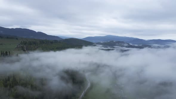 Fog in the Mountains. Slow Motion. Carpathians. Ukraine. Aerial.