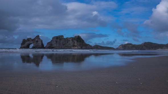 Wharariki Beach with rock arch