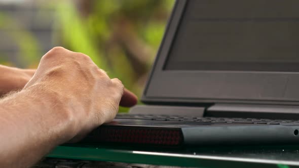 Man Enters Code Creates Website Clicking on Laptop