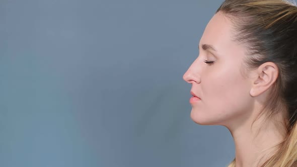 Various Pills Fall on Young Long Haired Woman Half-face