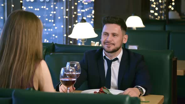 Man and Woman Celebrating Anniversary in Restaurant