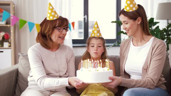 Mother, Daughter, Grandmother with Birthday Cake