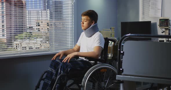 Teenager Patient Sitting in Wheelchair in Hospital