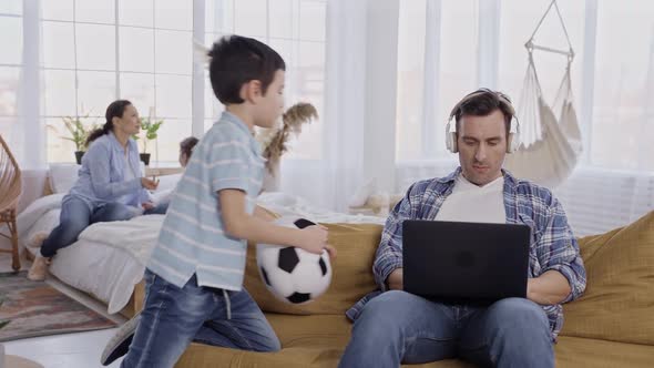 Father Busy at Laptop Refusing to Play with Son