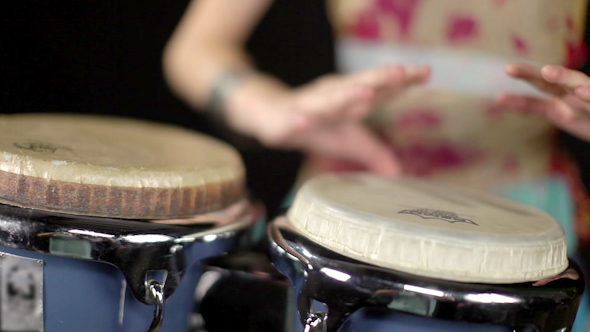 Female Percussion Drummer Performing With Bongos 11