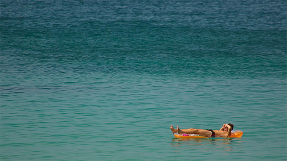 Sunbathes in Ocean