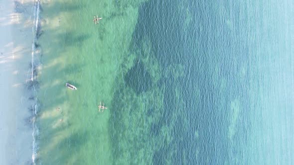 Vertical Video of the Ocean Near the Coast of Zanzibar Tanzania Aerial View