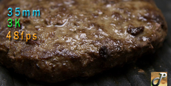 Burger Being Cooked On A Grill