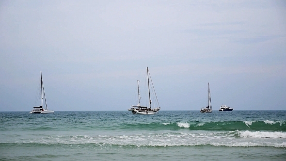Sailing Boats Dancing on Sea Waves