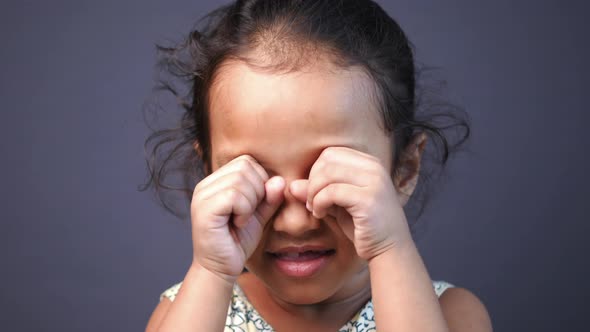 Sad Upset Child Girl Crying Against Gray Background