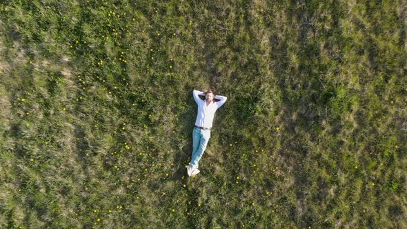 A Person That is Standing in the Grass