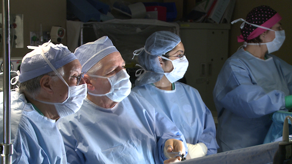 Group Of Surgeons Performing Surgery (7 Of 15)