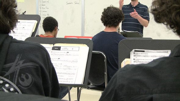 Music Teacher Instructing Class