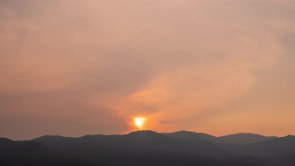 Time lapse of dramatic sunset with orange sky in a sunny day.