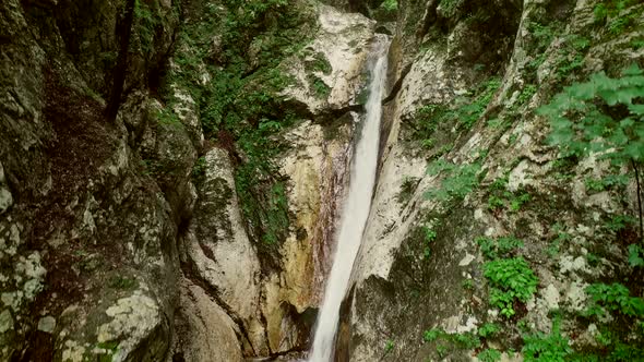 Aerial view of small waterfalls surrounded by big rocks at Soca river, Slovenia.