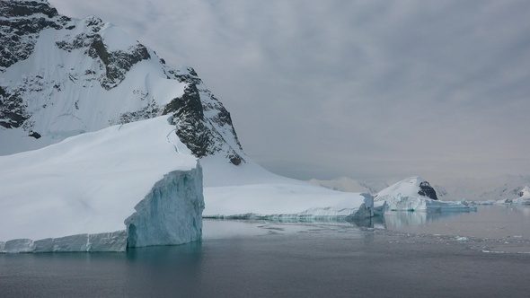 Antarctica. Icebergs. Big blue ice in icefjord. Affected by climate change and global warming.